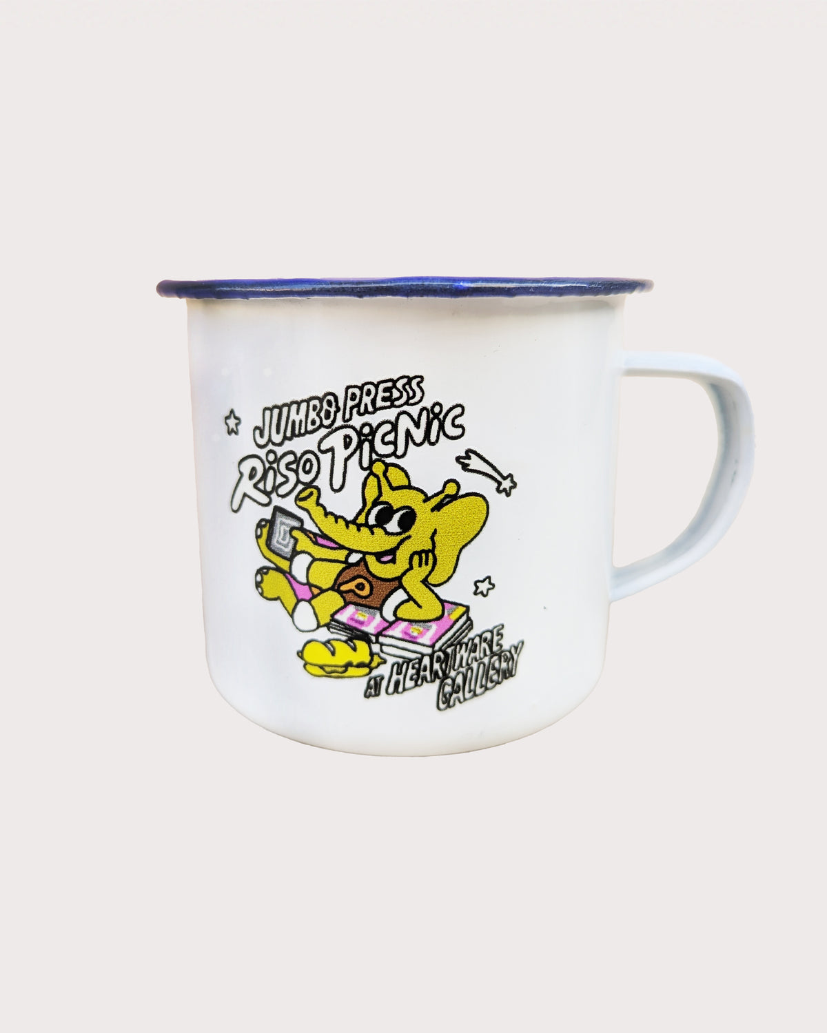 White enamel mug with colorful graphic design on a light gray background